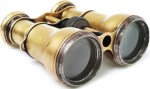 Old binoculars on white background
