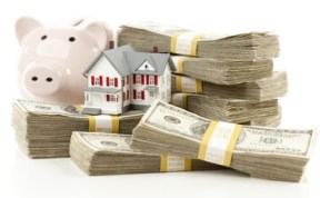 Small House and Piggy Bank with Stacks Money